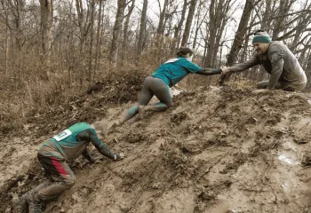 A family at the arctic dash in the mud
