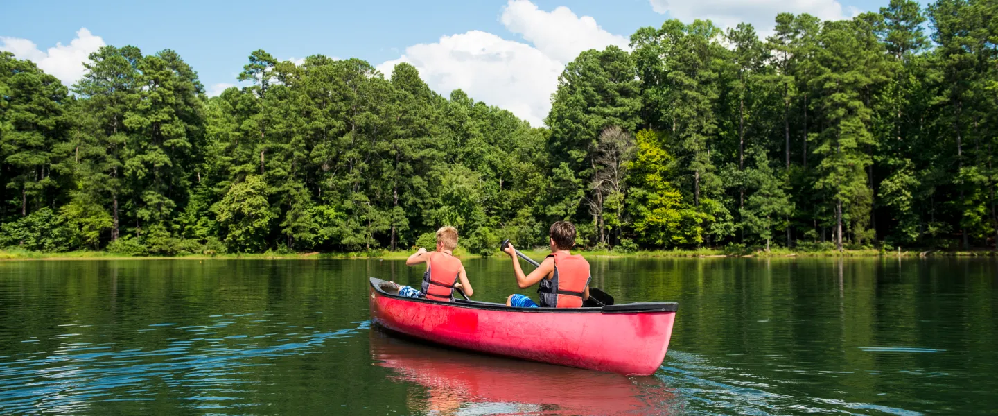 Kids in a canoe outdoors