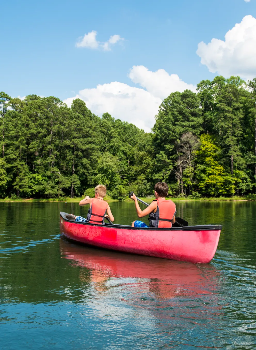 Kids in a canoe outdoors