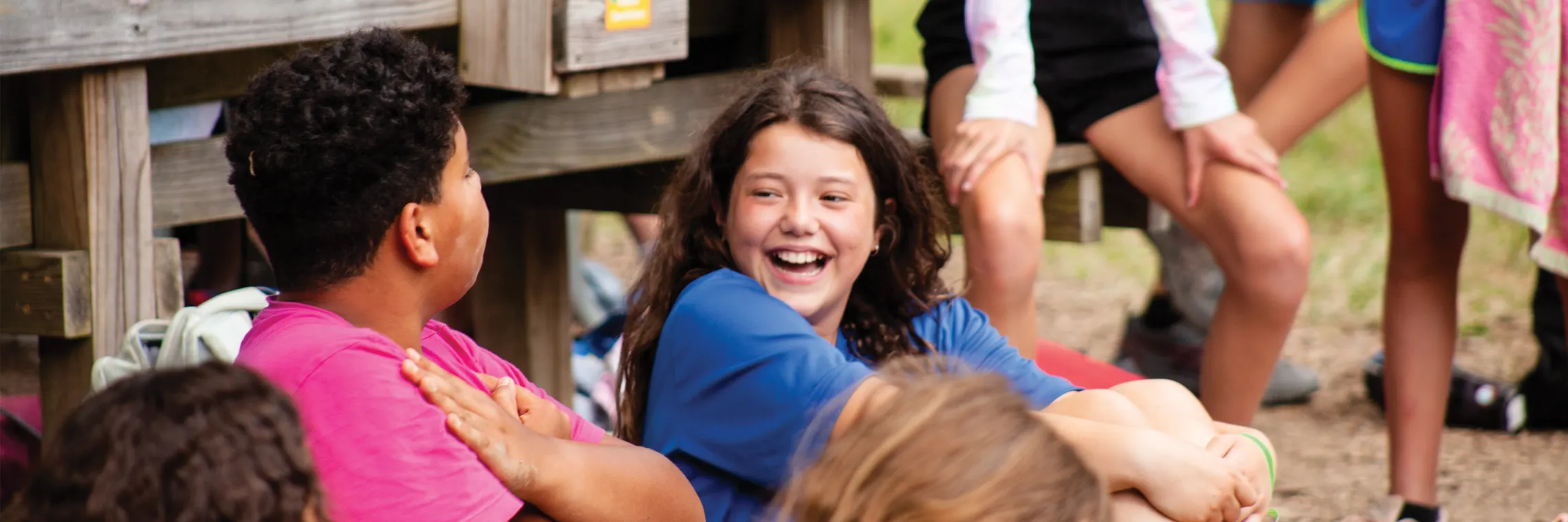 girl laughing with another kid