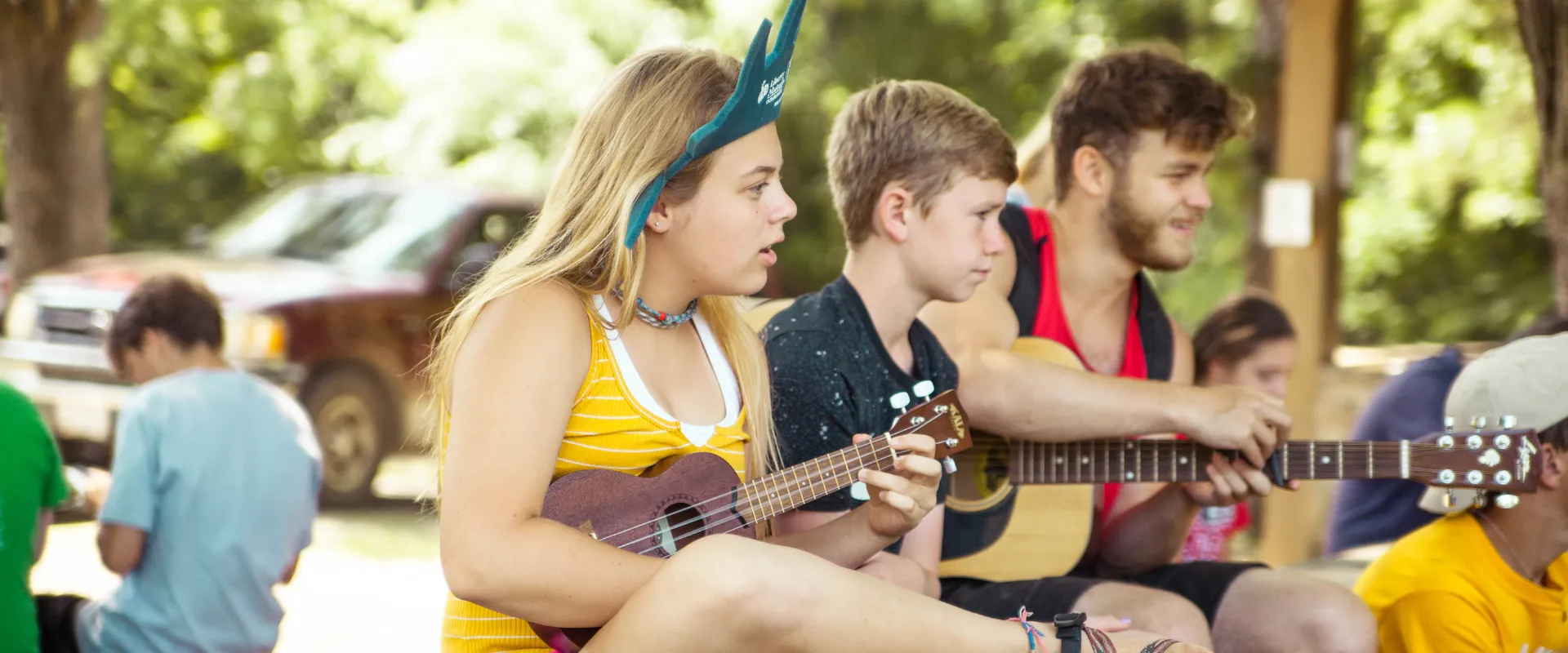 A group of campers playing instruments at camp