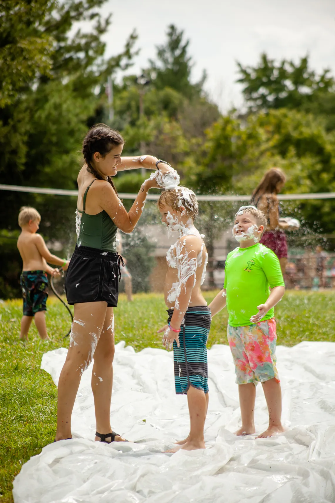 Kids Playing outdoors with water