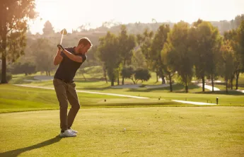 A man golfing